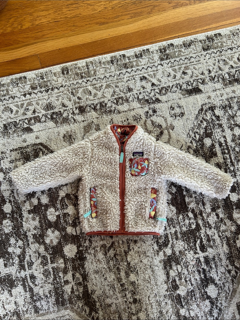 Patagonia Cream Sherpa Jacket with Rust Trim and Colorful Pocket Accents